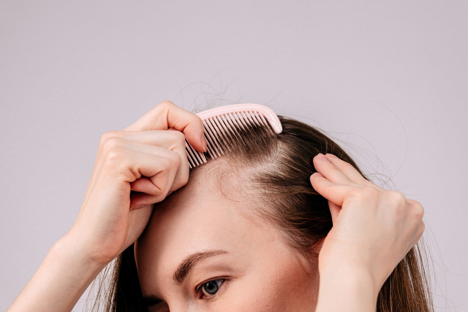 a woman combing her hair