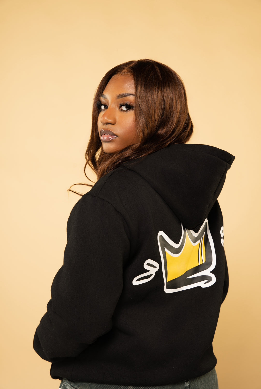 Woman wearing satin lined hoodie to protect natural hair